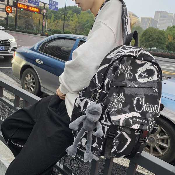 Waterproof Nylon Travel Spacious Backpack w/ Plush Pendant